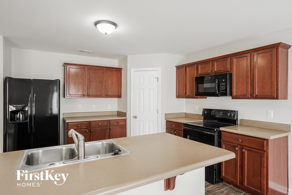 a kitchen with a counter top and a sink
