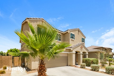 a house with a palm tree in front of it