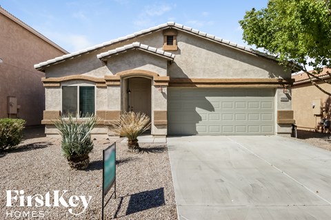 a house with a driveway and a garage door