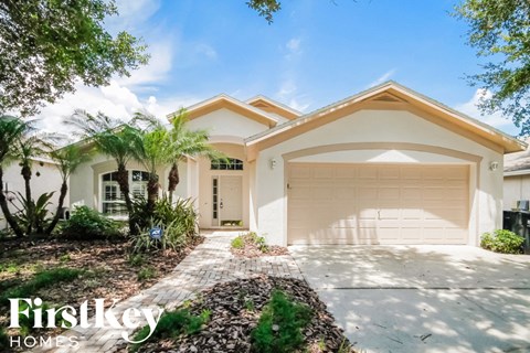 a house with a driveway and a garage door