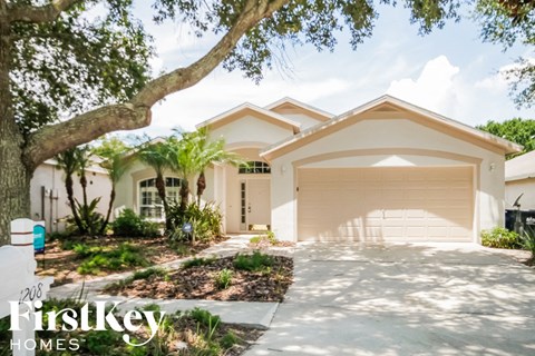 a house with a driveway and a garage door