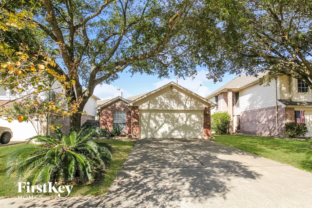 a house with a driveway and a garage door