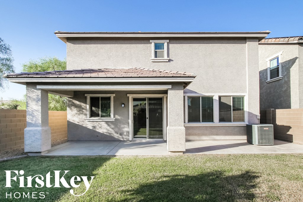 a house with a driveway and a patio
