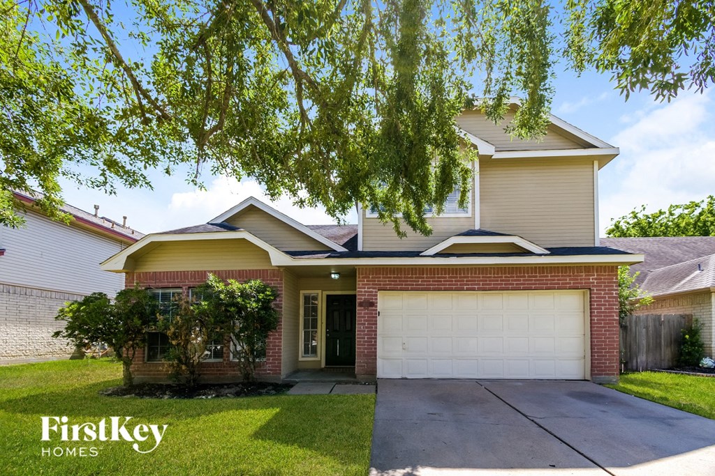 A house with a garage is for sale by FirstKey Homes.