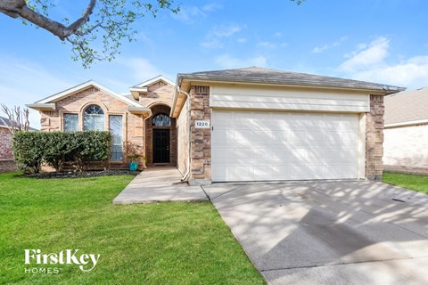 a house with a white garage door in front of it