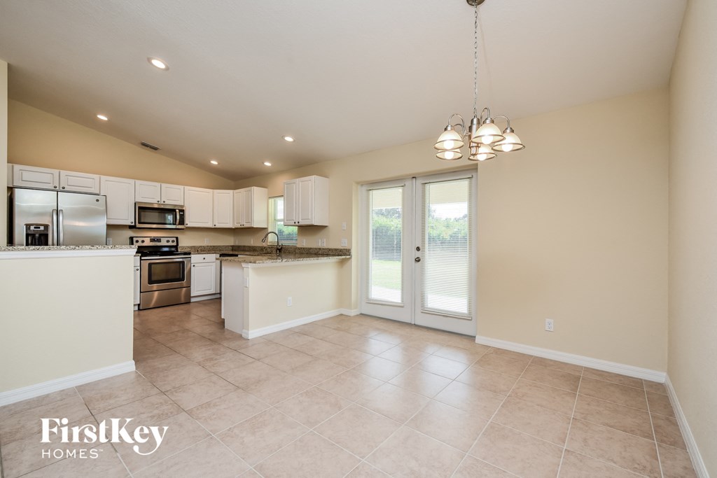 the kitchen is open to the dining room and living room
