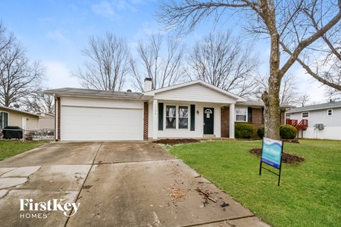 A house with a sign that says FirstKey Homes in front of it.