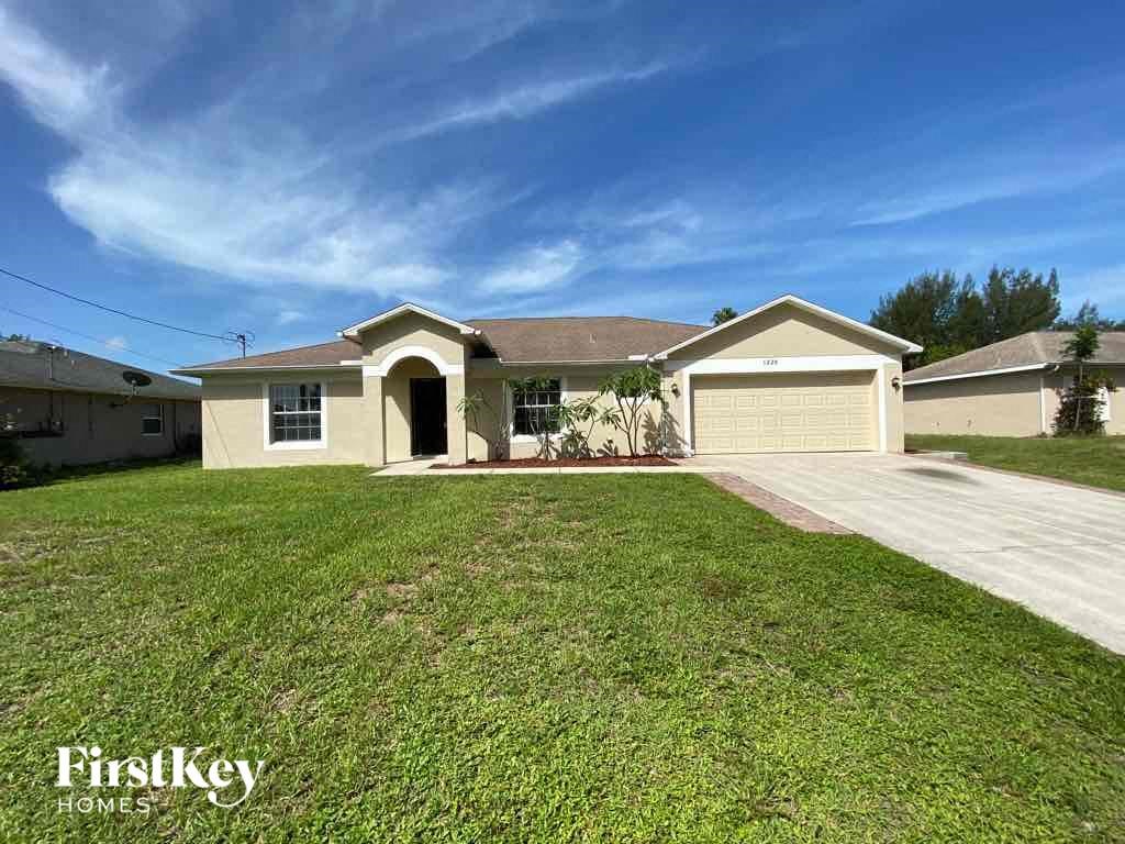A house with a garage is for sale by FirstKey Homes.