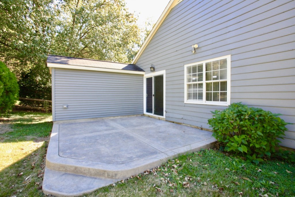 a concrete patio in front of a house