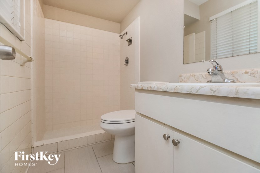 a bathroom with a toilet and a sink