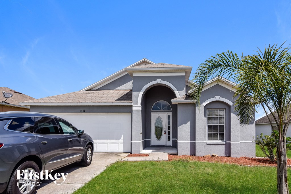 a house with a car parked in front of it