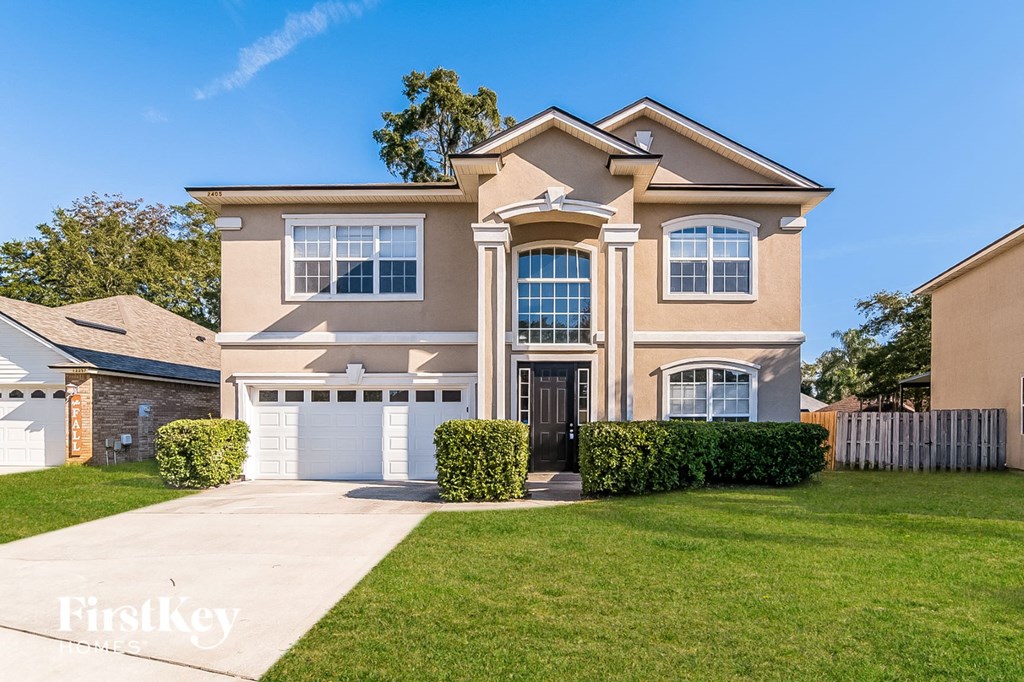 a large house with a lawn in front of it