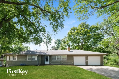A house with a tree in front of it.
