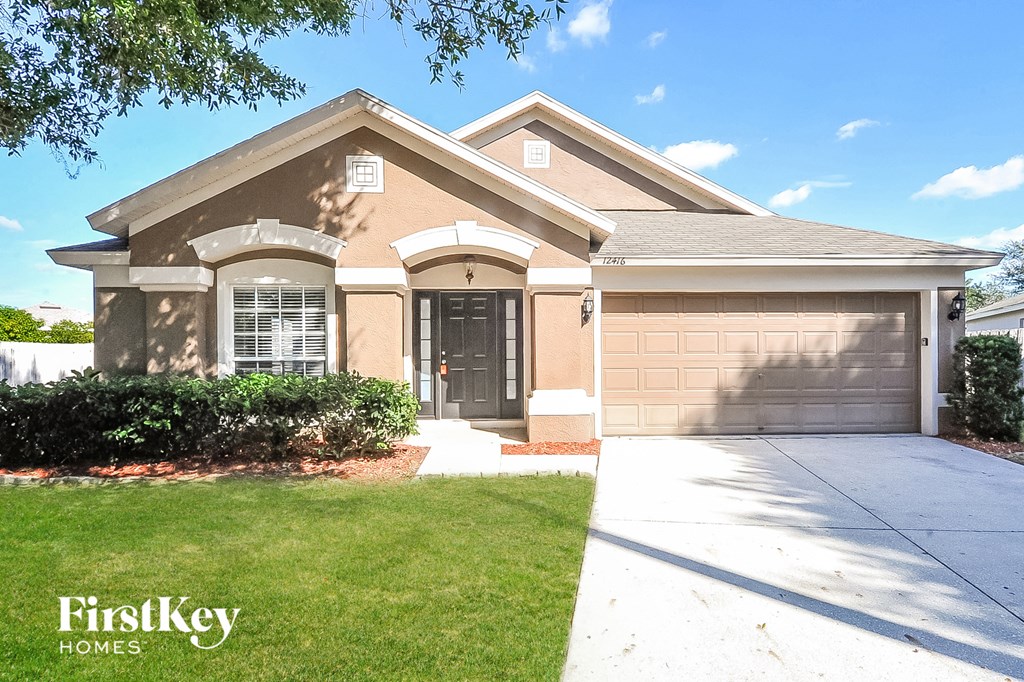 a house with a driveway and a garage door