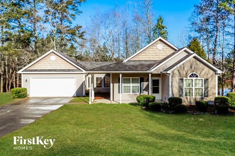 A house with a garage is for sale by FirstKey Homes.