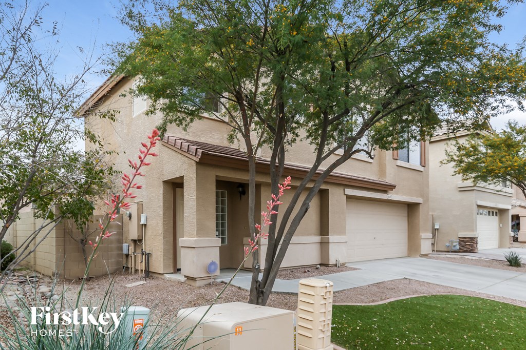 a house with a tree in front of it