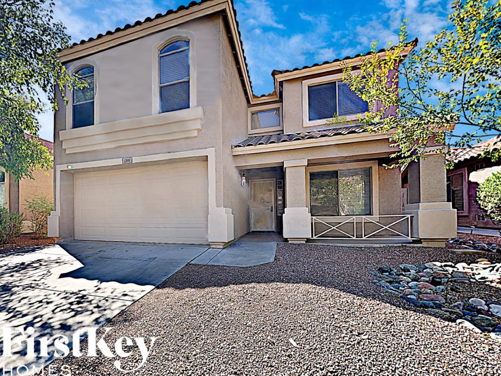 a house with a driveway and a garage door
