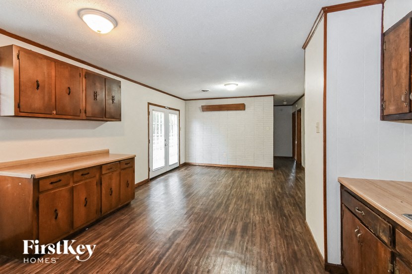 A kitchen with wooden cabinets and a countertop.