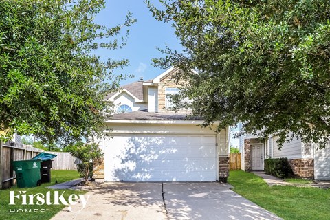 a white garage door in front of a house