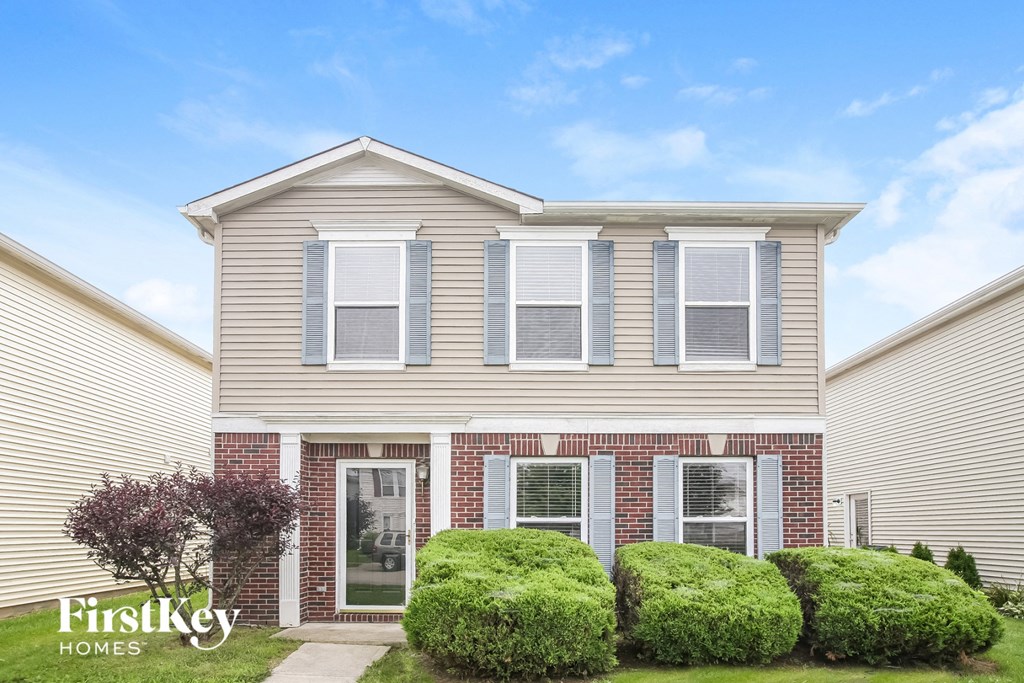 A house with the words "FirstKey Homes" on the front lawn.