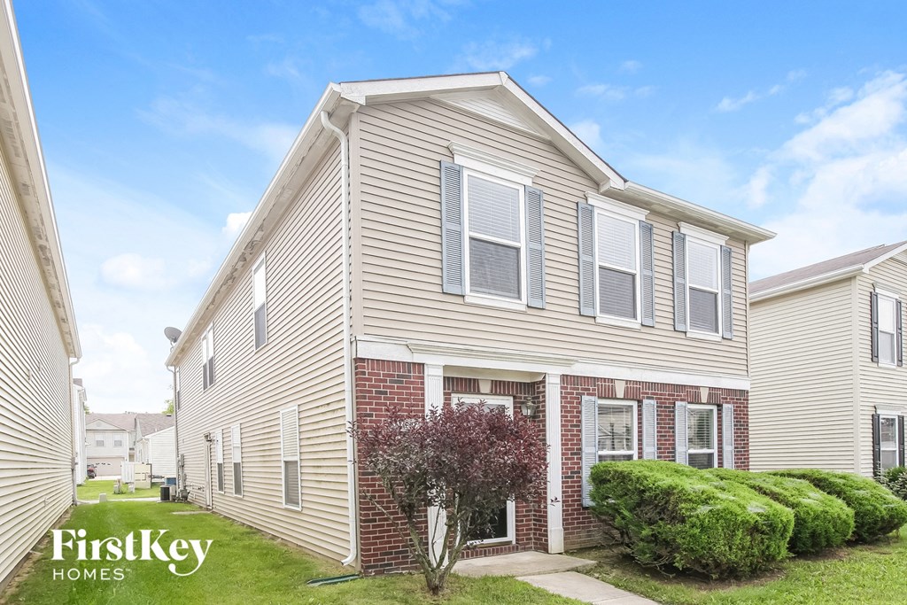 A house with the words "FirstKey Homes" on the lawn.
