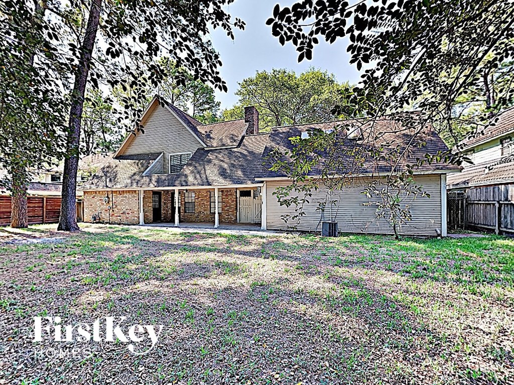 the backyard of a house with a yard and a garage