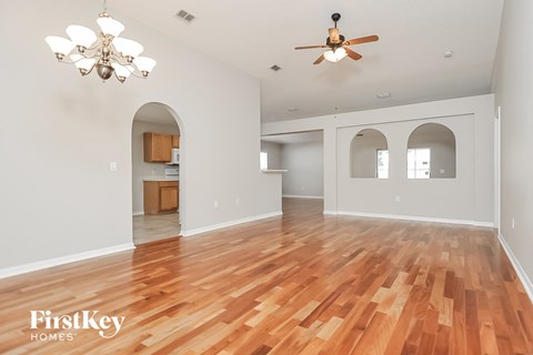 the living room and dining room are open to the kitchen