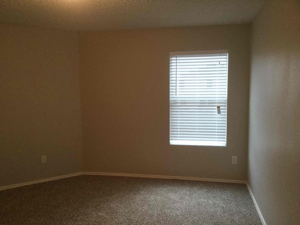 an empty room with a window in it