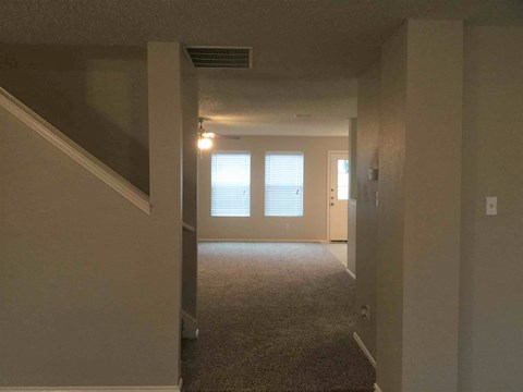 a view of a living room from the hallway of a house