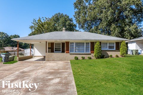 a home with a lawn and a driveway