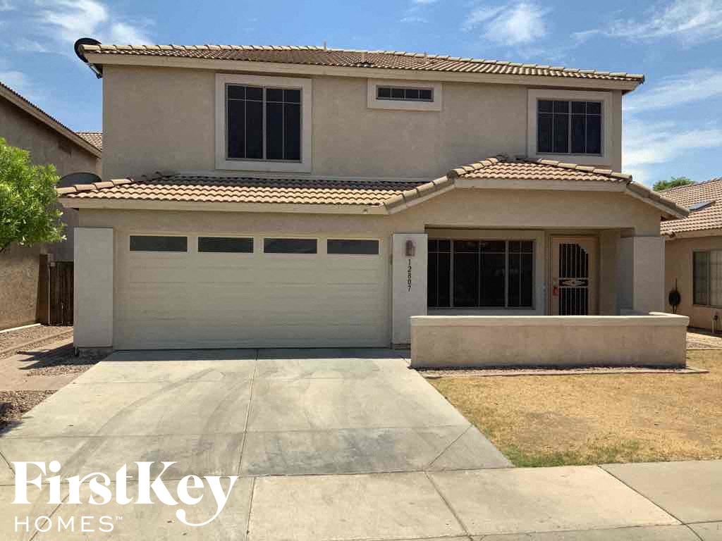 A two-story house with a garage is for sale by FirstKey Homes.