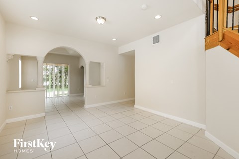 the living room and dining room are spacious and open to the backyard