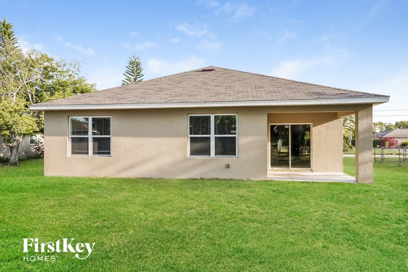 A house with a brown roof and a white wall is shown with the words "FirstKey Homes" on the bottom.