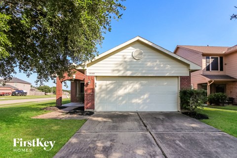 a white garage door in front of a house