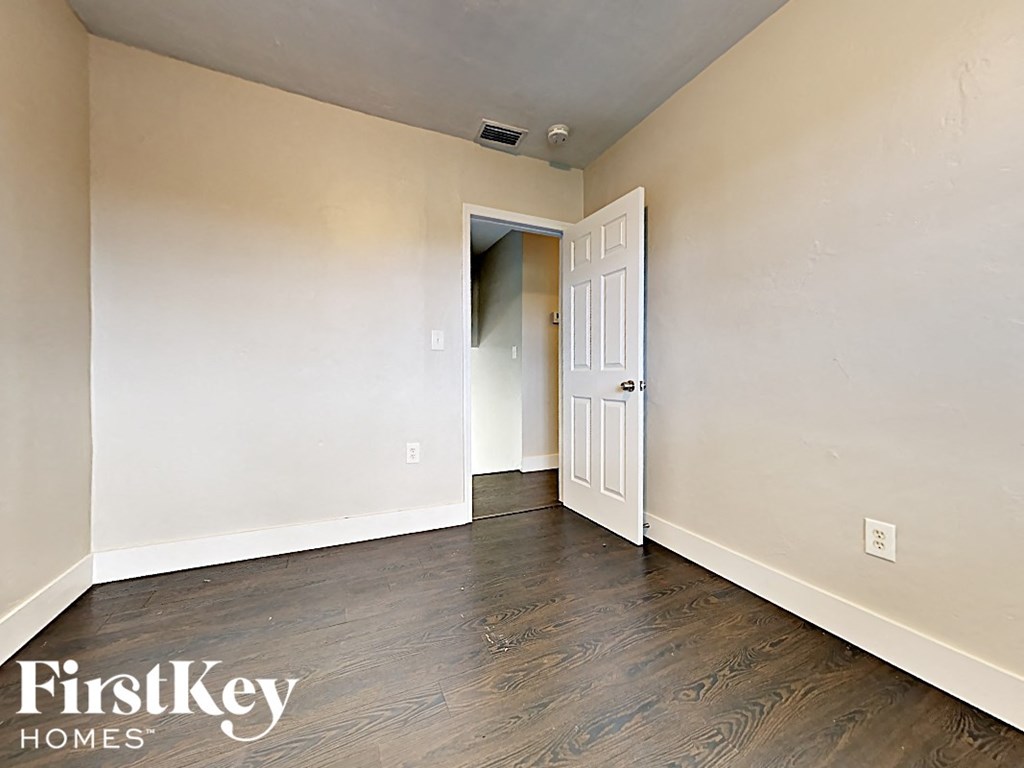 A room with a doorway leading to another room.