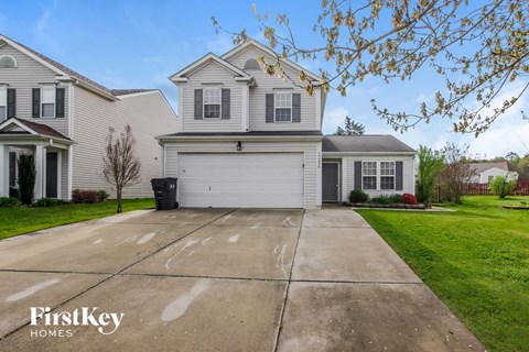 A house with a driveway in front of it.