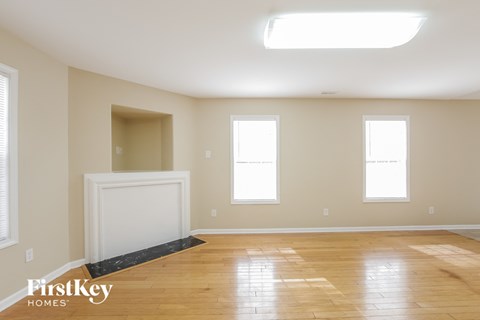 A room with wooden floors and a skylight.