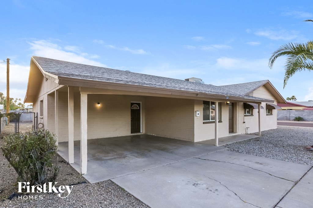 A house with a garage and a driveway is for sale.