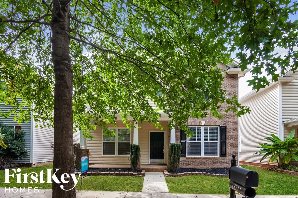 a house with a tree in front of it