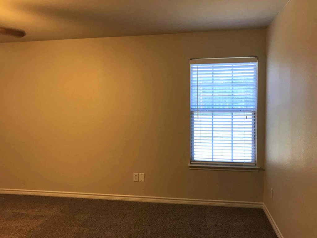 an empty room with a window in it
