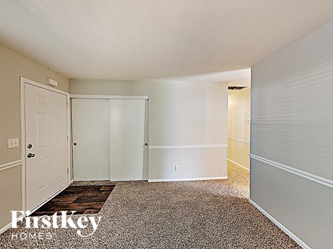 a master bedroom with a closet and a door to the bathroom