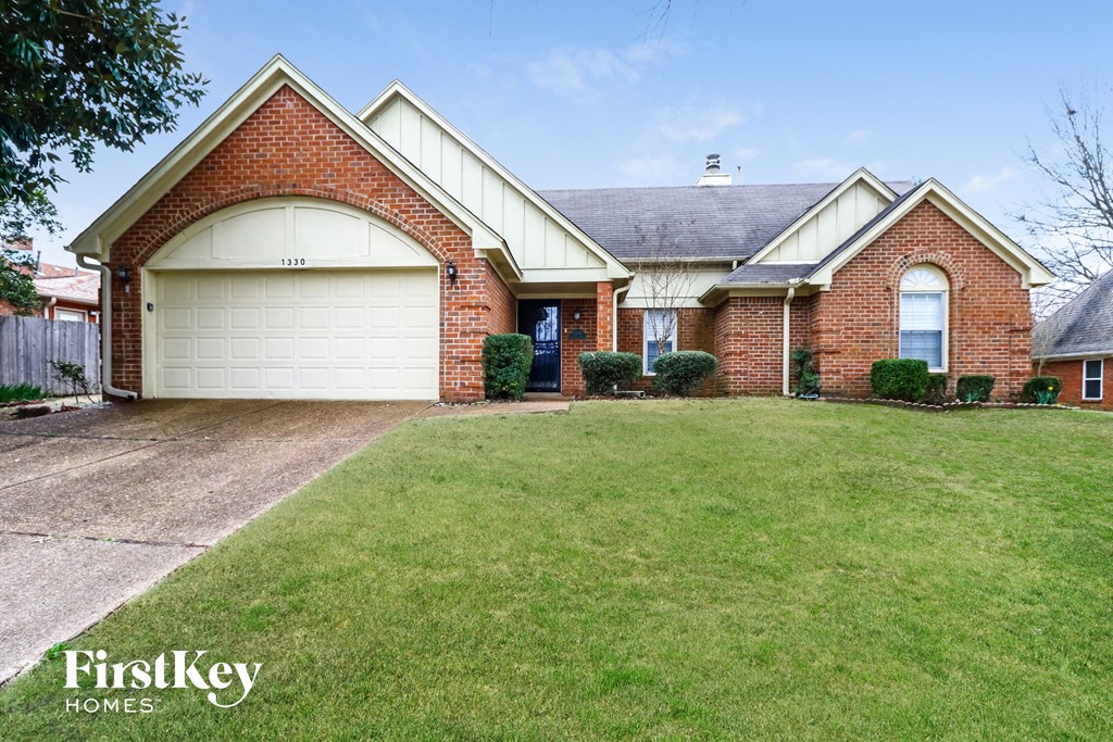 a home with a lawn in front of it