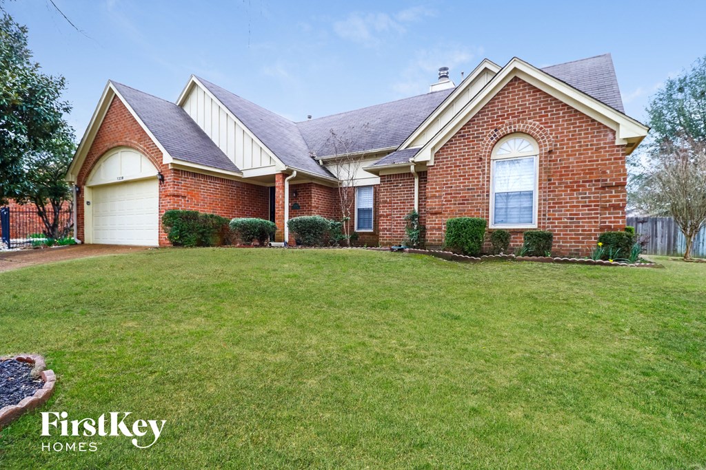 a home with a lawn in front of it