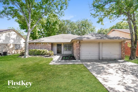 A house with a garage is for sale by FirstKey Homes.