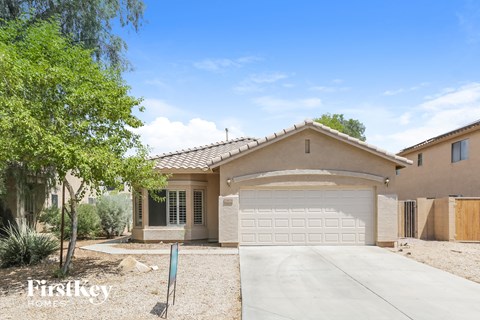 a house with a garage door and a driveway