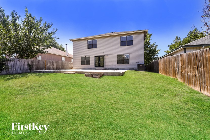A house with a lawn in front of it.