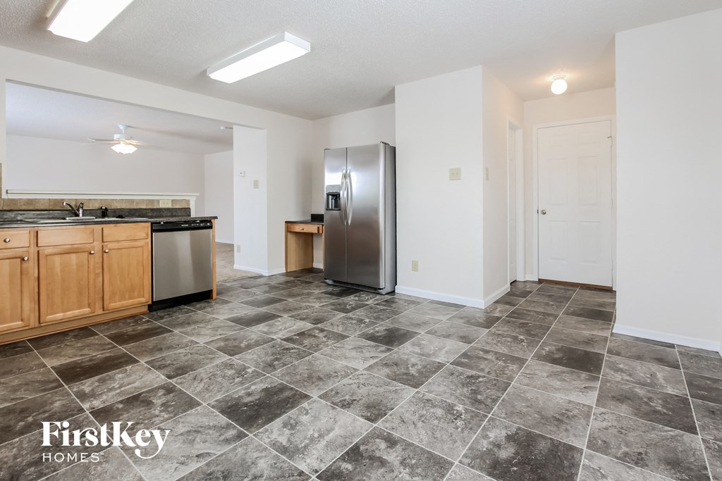 the kitchen is clean and ready to use with stainless steel appliances