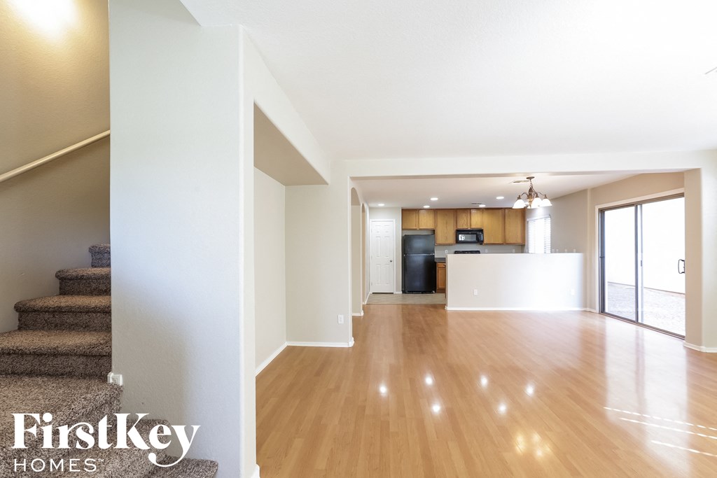 a view of a living room and a kitchen in a house