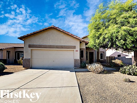 a house with a white garage door and a driveway