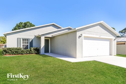 A modern house with a garage is for sale by FirstKey Homes.